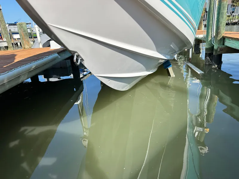 Slide: The Image of 2020 Nor-Tech 390 Sport boat docked in marina. - 43