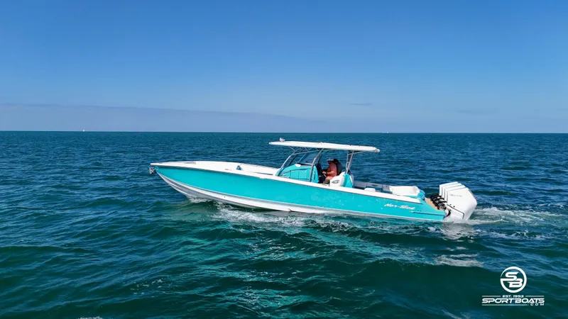 Slide: The Image of 2020 Nor-Tech 390 Sport boat cruising on open water. - 5