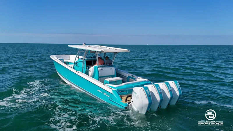 Slide: The Image of 2020 Nor-Tech 390 Sport boat cruising on open water. - 7