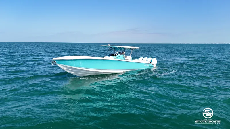 Slide: The Image of 2020 Nor-Tech 390 Sport boat cruising on open water. - 8