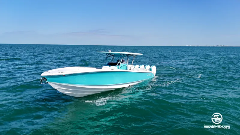 Slide: The Image of 2020 Nor-Tech 390 Sport boat cruising on open water. - 9