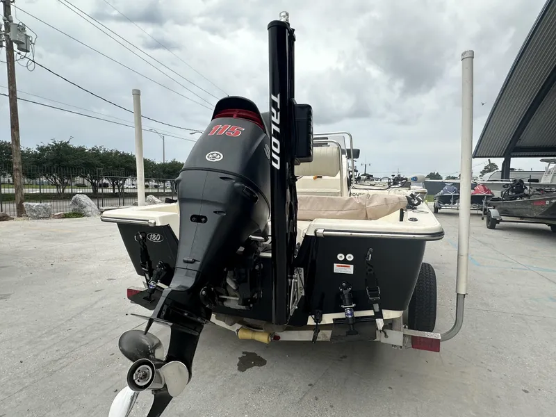 Slide: The Image of 2016 Frontier 180 CC boat with 115 HP motor, parked on a trailer. - 5