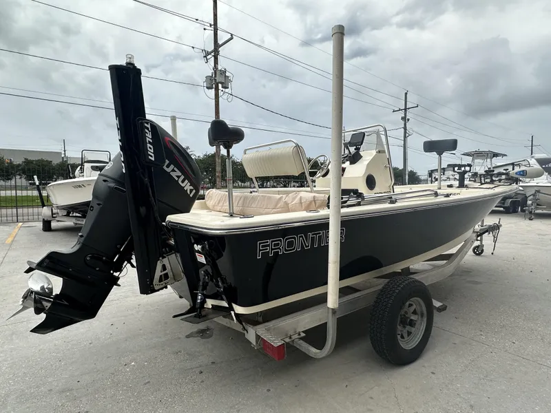 Slide: The Image of 2016 Frontier 180 CC boat with Suzuki outboard motor on trailer. - 6