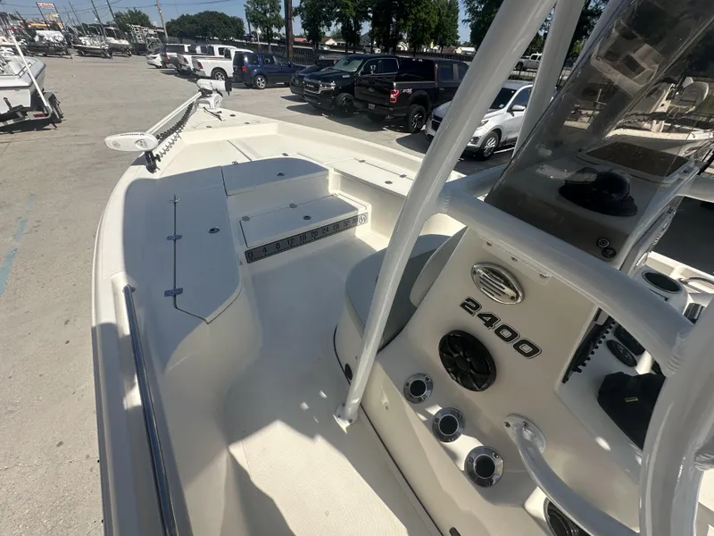 Slide: The Image of 2021 Bulls Bay 2400 boat interior with console and seating area. - 12