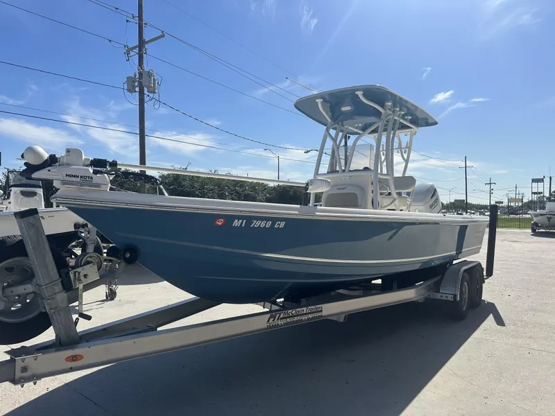 Slide: The Image of 2021 Bulls Bay 2400 boat on a trailer with Minn Kota trolling motor. - 13