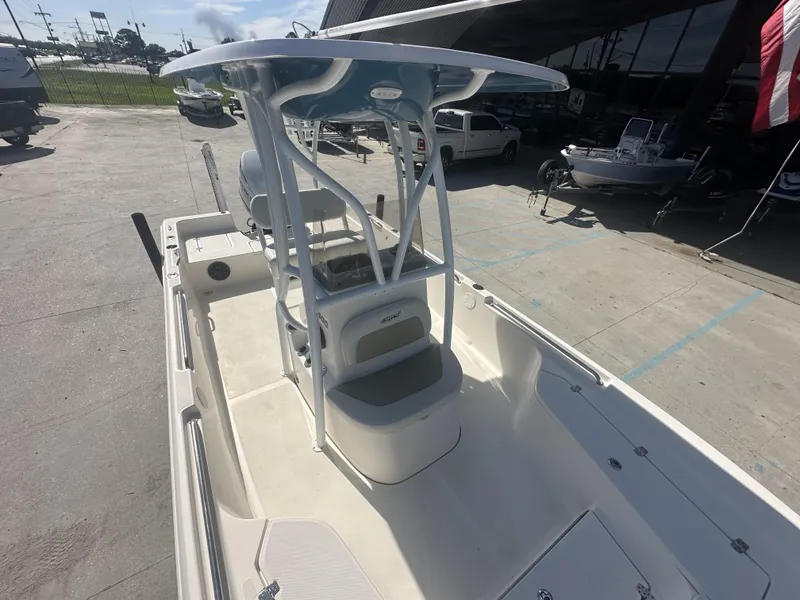 Slide: The Image of 2021 Bulls Bay 2400 center console boat with T-top, docked at a marina. - 14