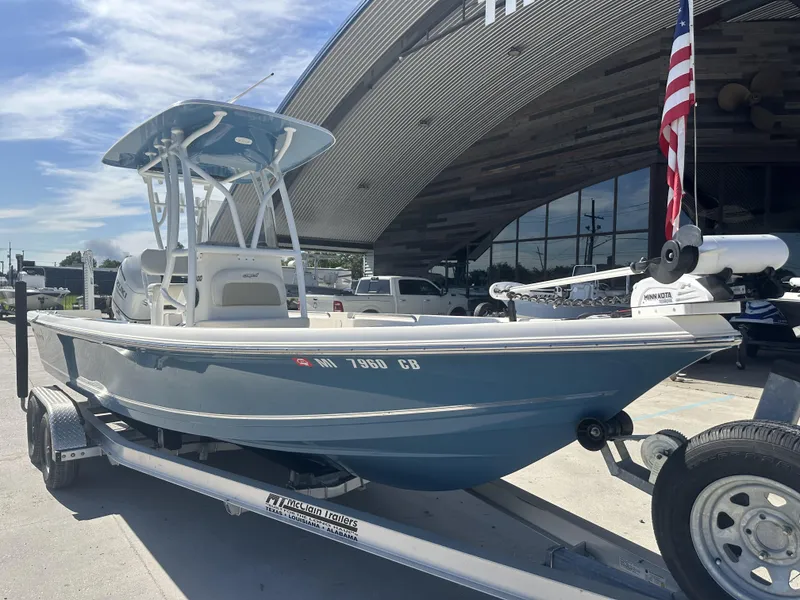 Slide: The Image of 2021 Bulls Bay 2400 boat on trailer outside a modern building. - 15