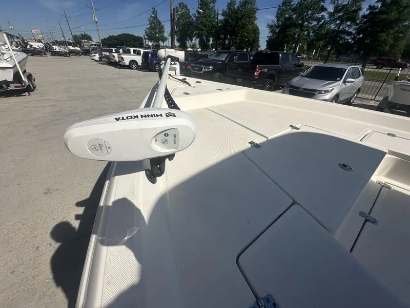 Slide: The Image of 2021 Bulls Bay 2400 boat with Minn Kota trolling motor in a parking lot. - 16