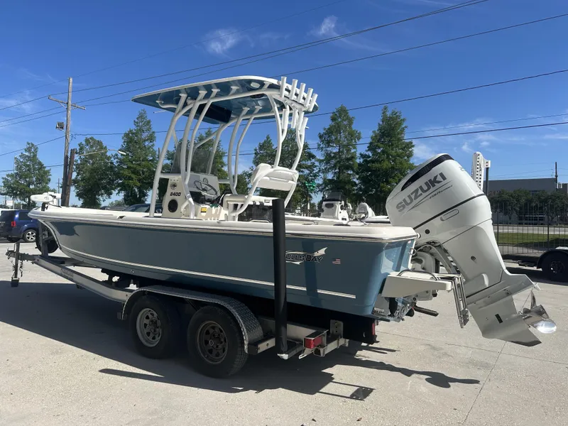 Slide: The Image of 2021 Bulls Bay 2400 boat with Suzuki outboard motor on trailer. - 18