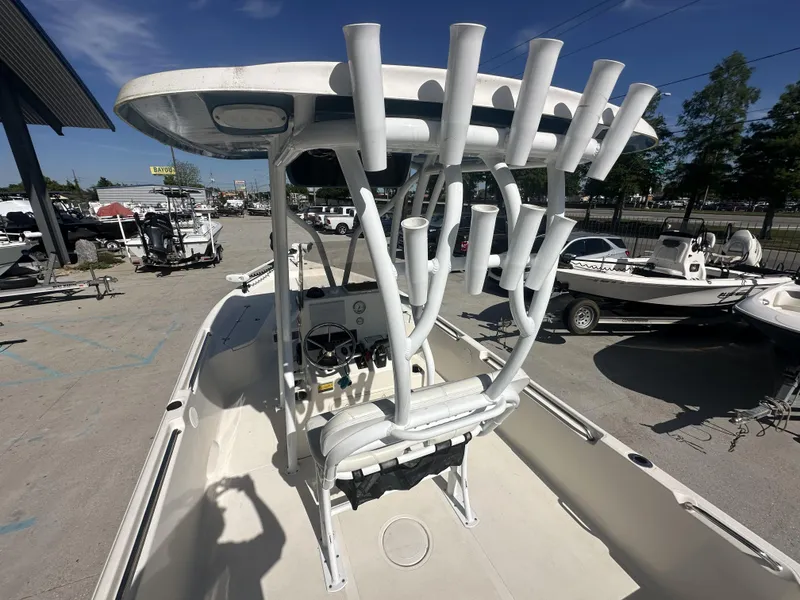 Slide: The Image of 2021 Bulls Bay 2400 boat with T-top and rod holders in a marina. - 20