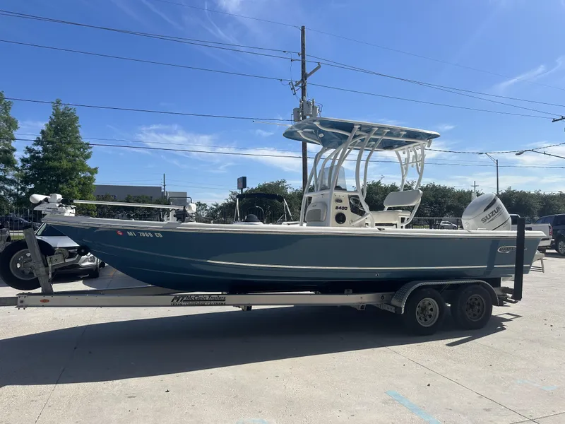 Slide: The Image of 2021 Bulls Bay 2400 boat on a trailer in a parking lot. - 22