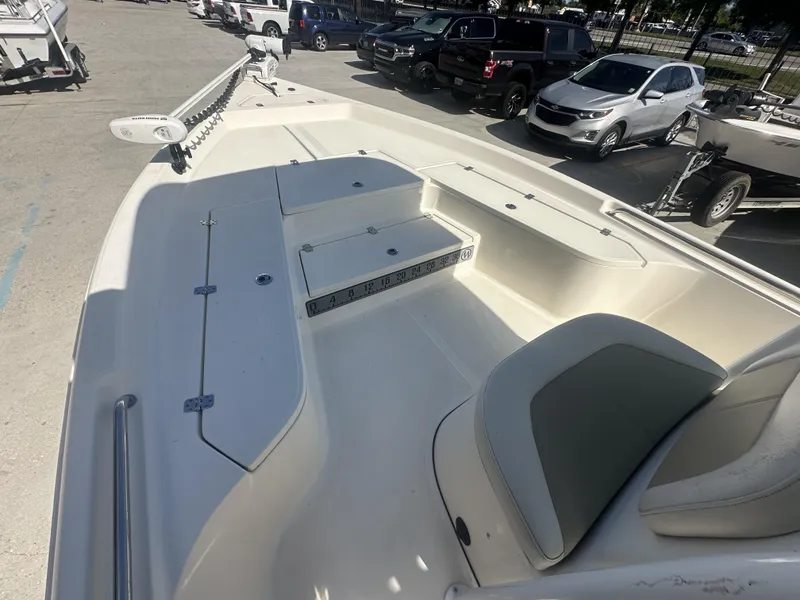 Slide: The Image of 2021 Bulls Bay 2400 boat interior with seating and storage compartments. - 4