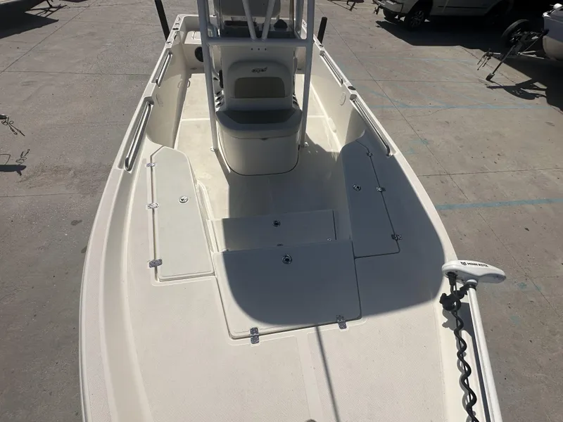 Slide: The Image of 2021 Bulls Bay 2400 boat interior, spacious deck, and storage compartments. - 5