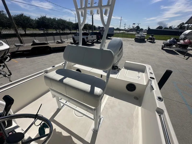 Slide: The Image of 2021 Bulls Bay 2400 boat interior with seating and steering wheel. - 7