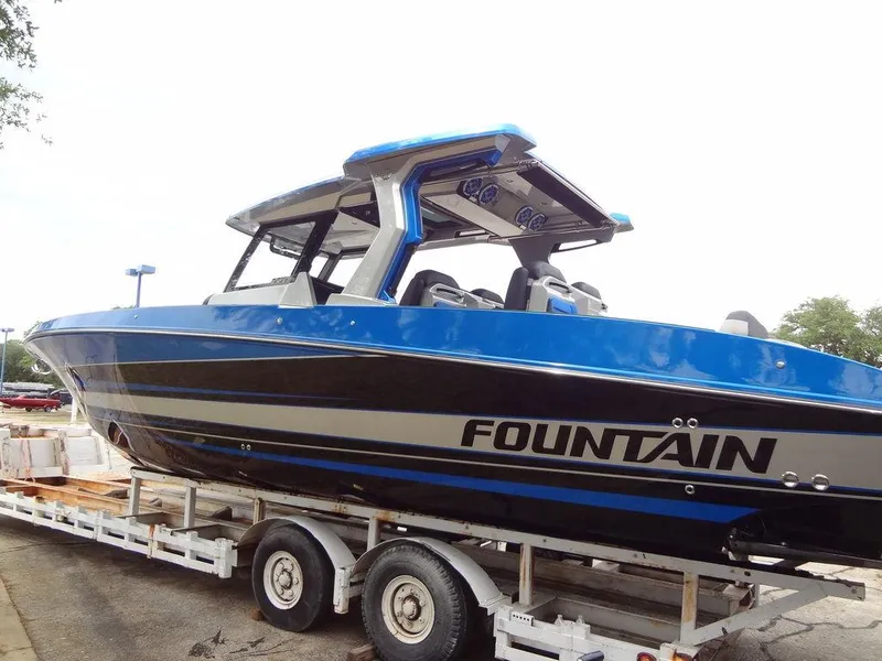 Slide: The Image of 2024 Fountain 38 SCX boat in blue and black on a trailer. - 15