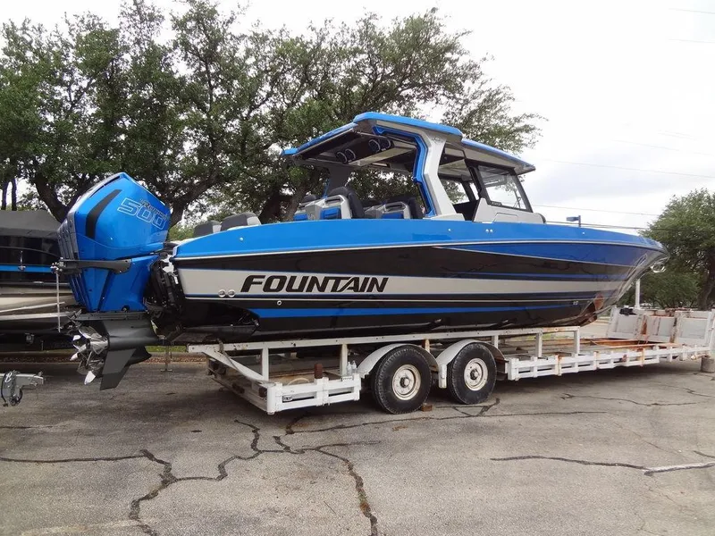 Slide: The Image of 2024 Fountain 38 SCX boat on trailer, blue and black. - 17