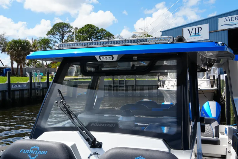 Slide: The Image of 2024 Fountain 38 SCX boat docked, featuring sleek design and modern amenities. - 33