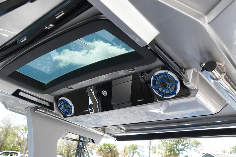 Slide: The Image of 2024 Fountain 38 SCX boat with skylight and blue speakers, showcasing modern design. - 36