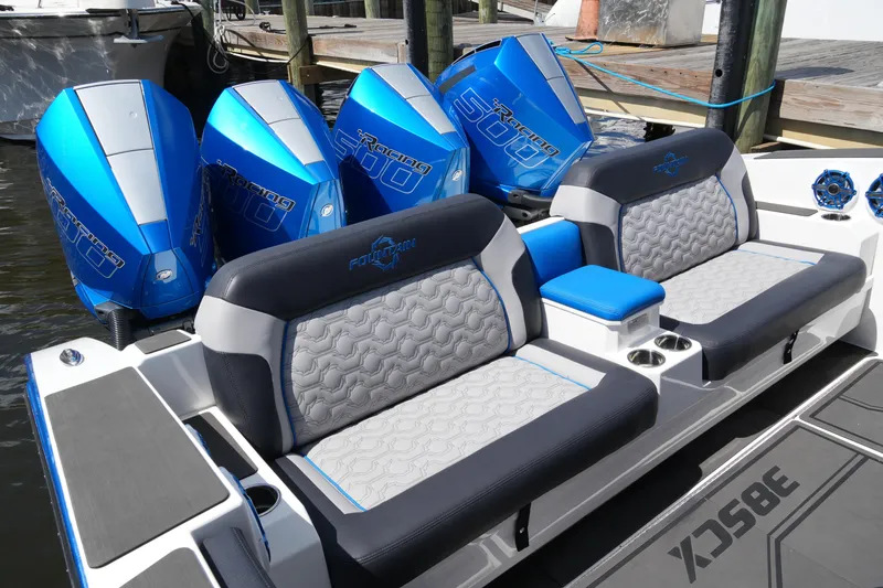 Slide: The Image of 2024 Fountain 38 SCX boat with blue racing engines and luxury seating. - 39
