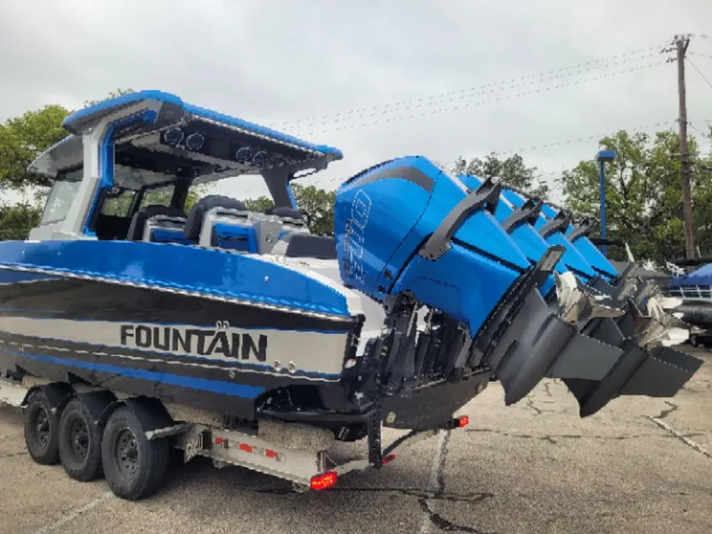 Slide: The Image of 2024 Fountain 38 SCX boat with triple outboard engines on a trailer. - 4