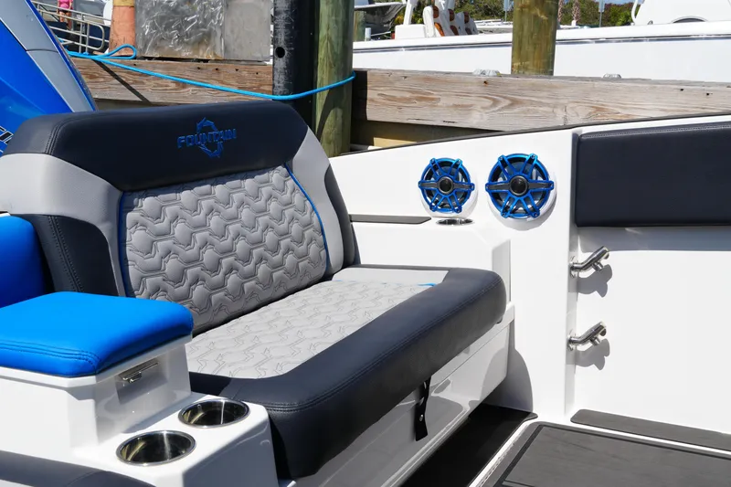 Slide: The Image of 2024 Fountain 38 SCX boat interior with stylish seating and blue speakers. - 41