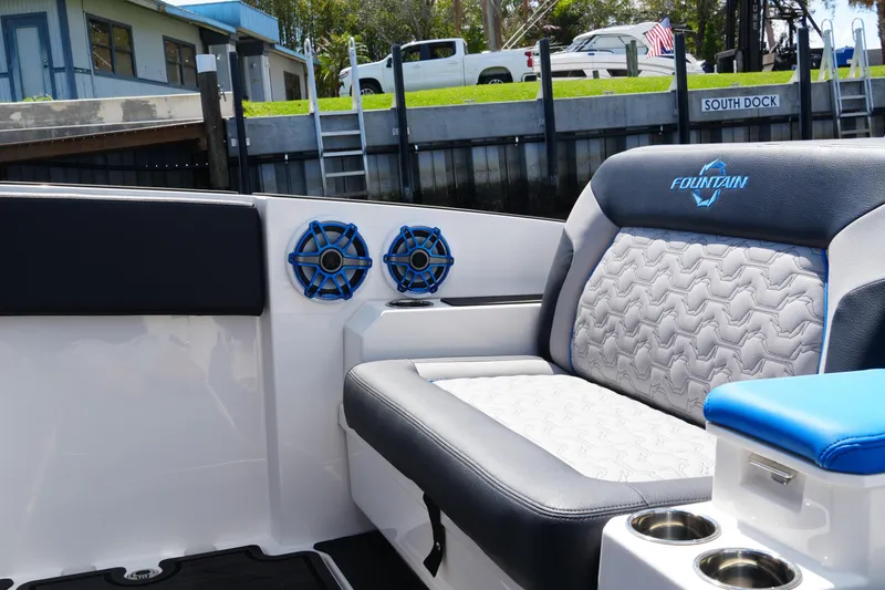 Slide: The Image of 2024 Fountain 38 SCX boat interior with stylish seating and blue speakers. - 42