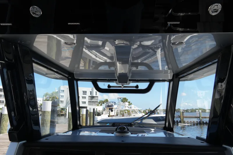 Slide: The Image of 2024 Fountain 38 SCX boat interior view at a marina dock. - 56