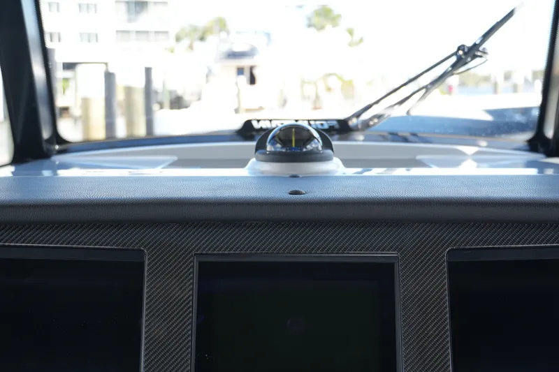 Slide: The Image of Dashboard view of 2024 Fountain 38 SCX boat with navigation instruments. - 57