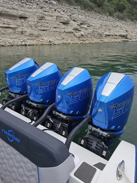 Slide: The Image of 2024 Fountain 38 SCX with quad Mercury Racing 500 outboard engines on a lake. - 9