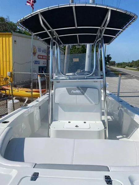 Slide: The Image of 2024 Parker 18SE Center Console boat with T-top and seating. - 2