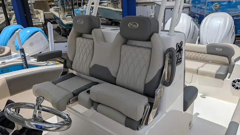 Slide: The Image of 2025 Key West 291 FS boat interior with luxurious seating and steering wheel. - 10