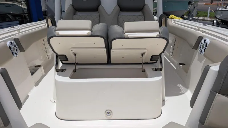 Slide: The Image of 2025 Key West 291 FS boat interior with open storage compartments and seating. - 17