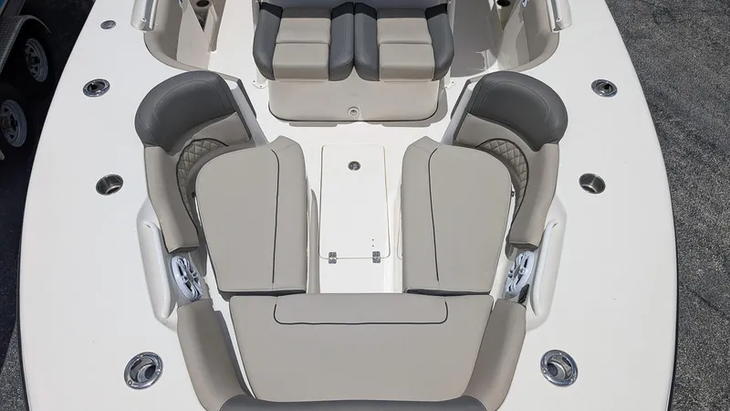 Slide: The Image of 2025 Key West 291 FS boat interior with cushioned seating and storage compartments. - 18