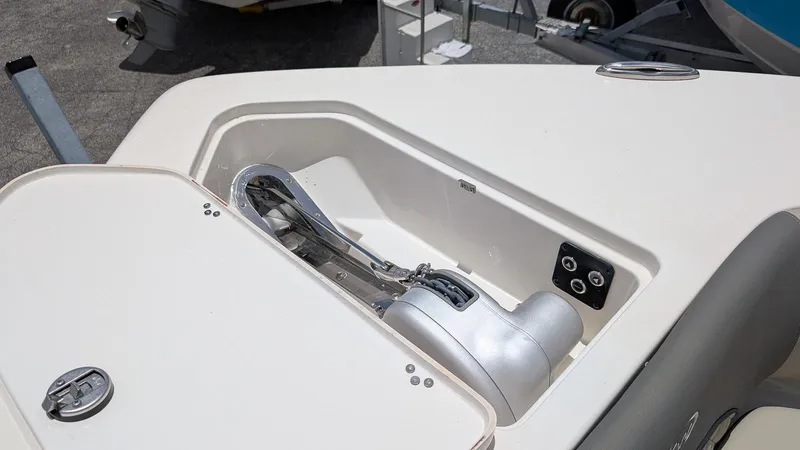 Slide: The Image of 2025 Key West 291 FS boat anchor compartment with winch and control panel. - 20