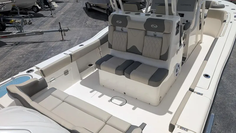 Slide: The Image of 2025 Key West 291 FS boat interior with cushioned seating and modern design. - 5