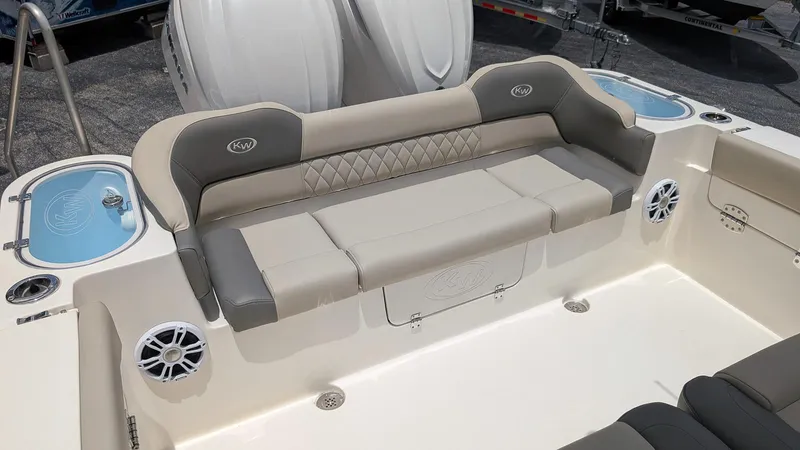 Slide: The Image of 2025 Key West 291 FS boat interior with cushioned seating and built-in speakers. - 6