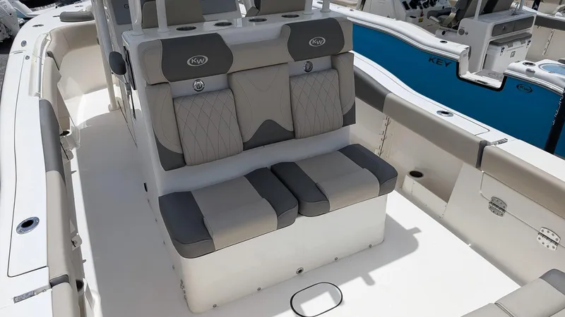 Slide: The Image of 2025 Key West 291 FS boat interior with cushioned seating and modern design. - 8