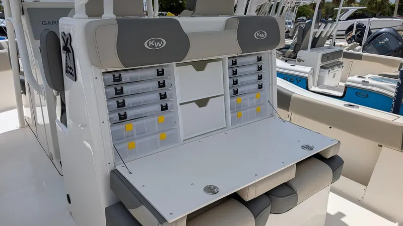 Slide: The Image of 2025 Key West 291 FS boat with organized tackle storage and seating. - 9
