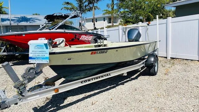 Slide: The Image of 1983 Maverick 18 Flats Boat on Continental trailer in outdoor setting. - 1