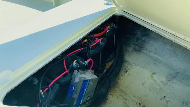Slide: The Image of Battery compartment of a 1983 Maverick 18 Flats Boat with wiring and connections. - 10