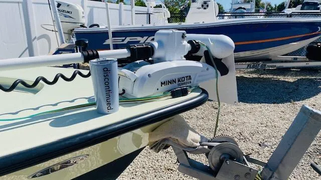 Slide: The Image of 1983 Maverick 18 Flats Boat with Minn Kota trolling motor in a boatyard. - 3