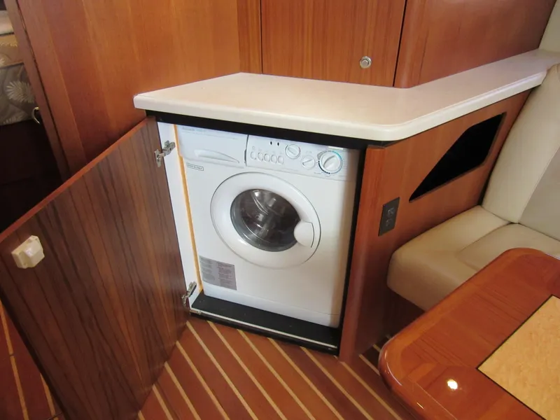 Slide: The Image of 2006 Tiara Yachts 4300 Sovran interior with built-in washing machine. - 13