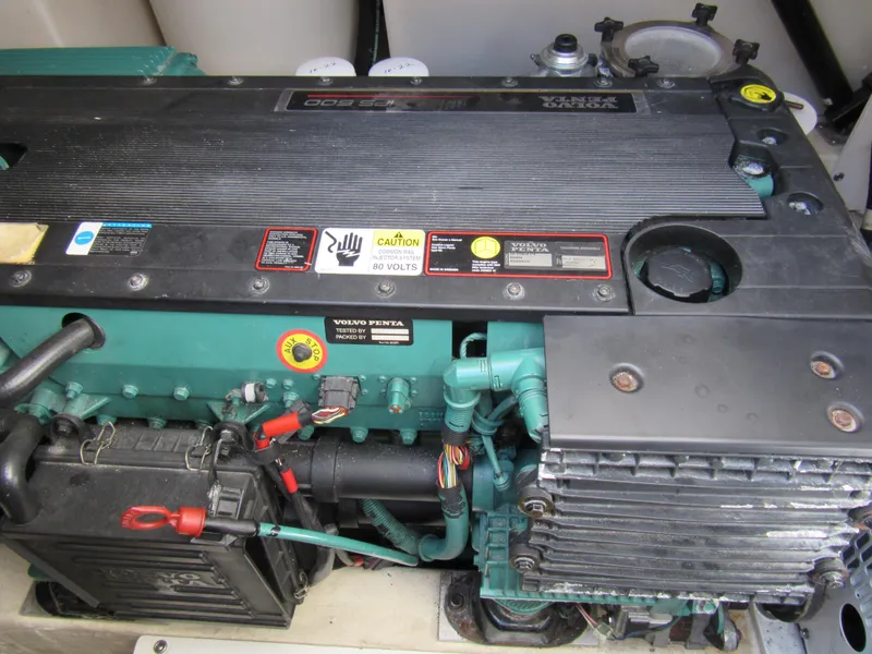 Slide: The Image of Engine compartment of a 2006 Tiara Yachts 4300 Sovran, featuring a Volvo Penta engine. - 21