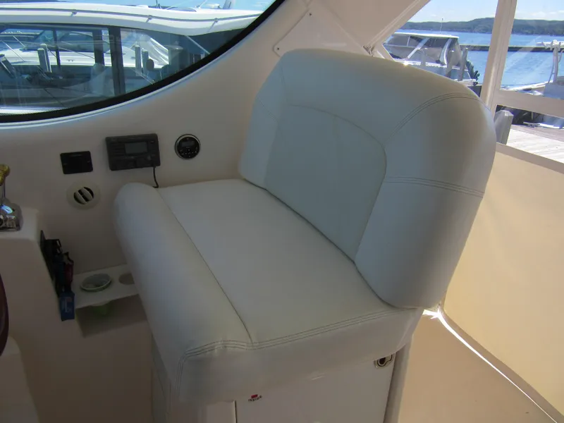 Slide: The Image of 2006 Tiara Yachts 4300 Sovran interior with white cushioned seating. - 5