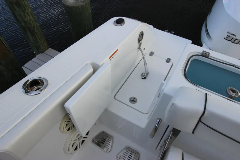 Slide: The Image of Wellcraft 302 Fisherman 2020 boat interior with sink and storage compartments. - 13
