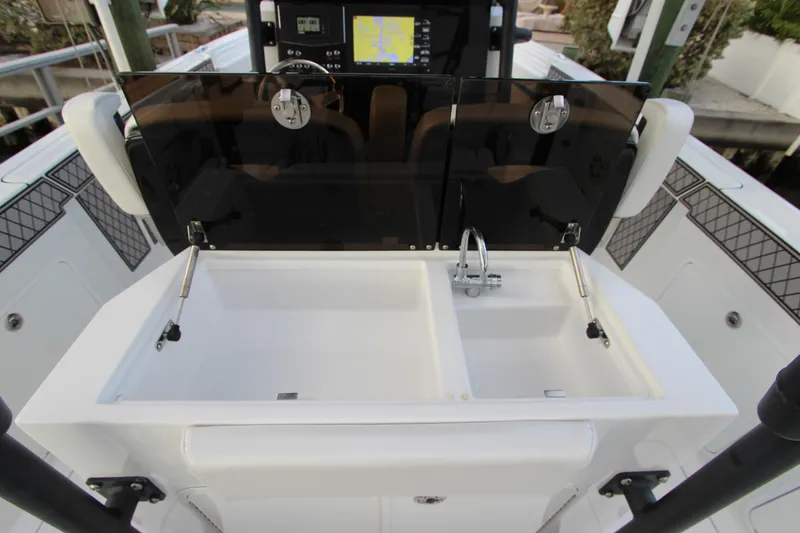 Slide: The Image of 2020 Wellcraft 302 Fisherman boat with dual sink and control panel. - 18