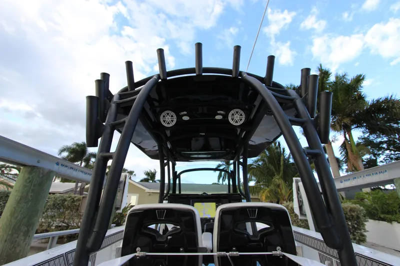 Slide: The Image of 2020 Wellcraft 302 Fisherman boat with T-top and rod holders. - 19