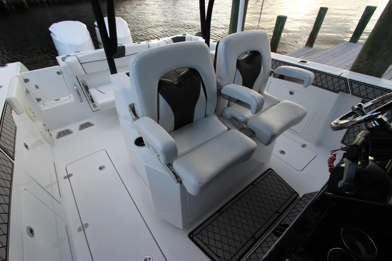 Slide: The Image of 2020 Wellcraft 302 Fisherman boat interior with dual captain's chairs. - 20