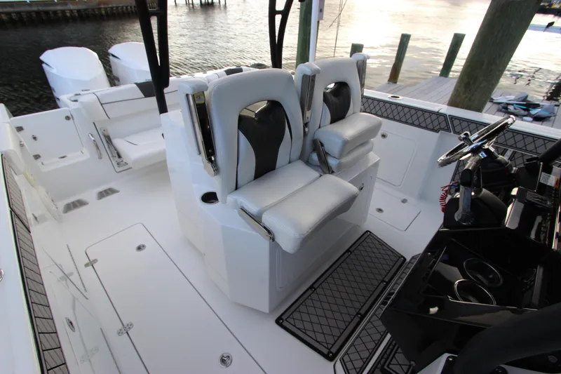 Slide: The Image of 2020 Wellcraft 302 Fisherman boat interior with dual captain's chairs and helm station. - 21