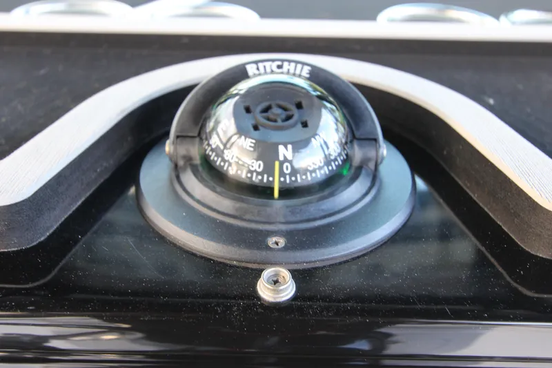 Slide: The Image of Close-up of a Ritchie compass on a 2020 Wellcraft 302 Fisherman boat. - 30
